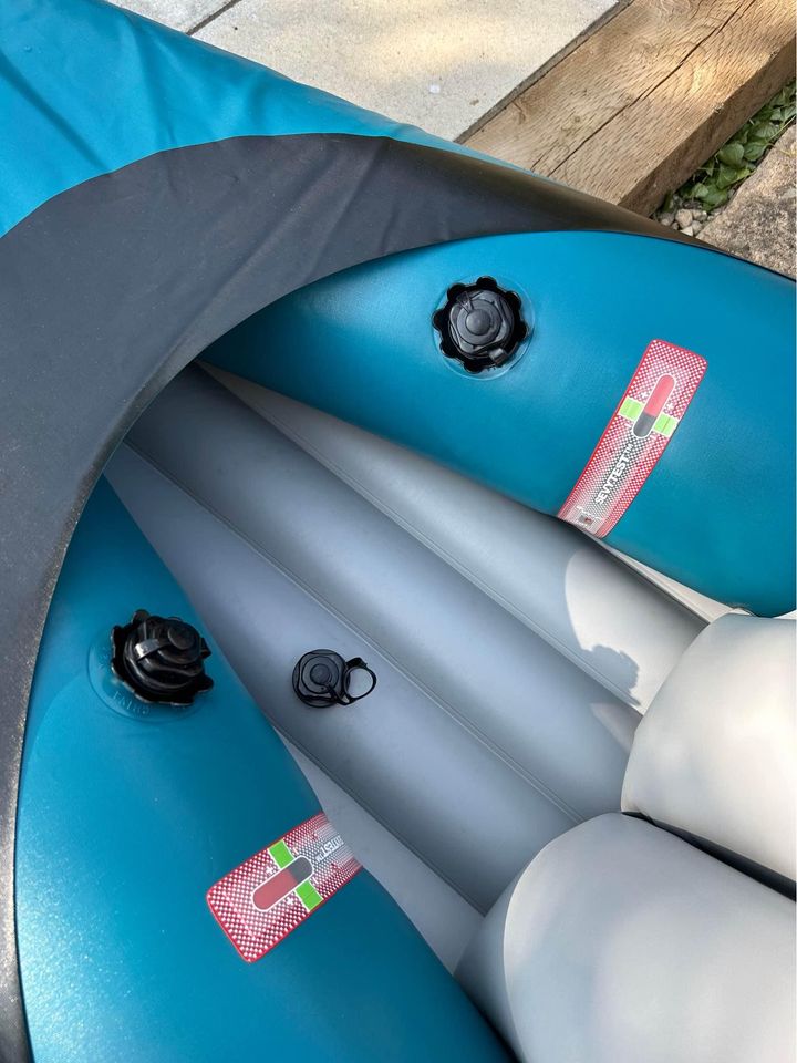 Inflatable double kayak with paddles